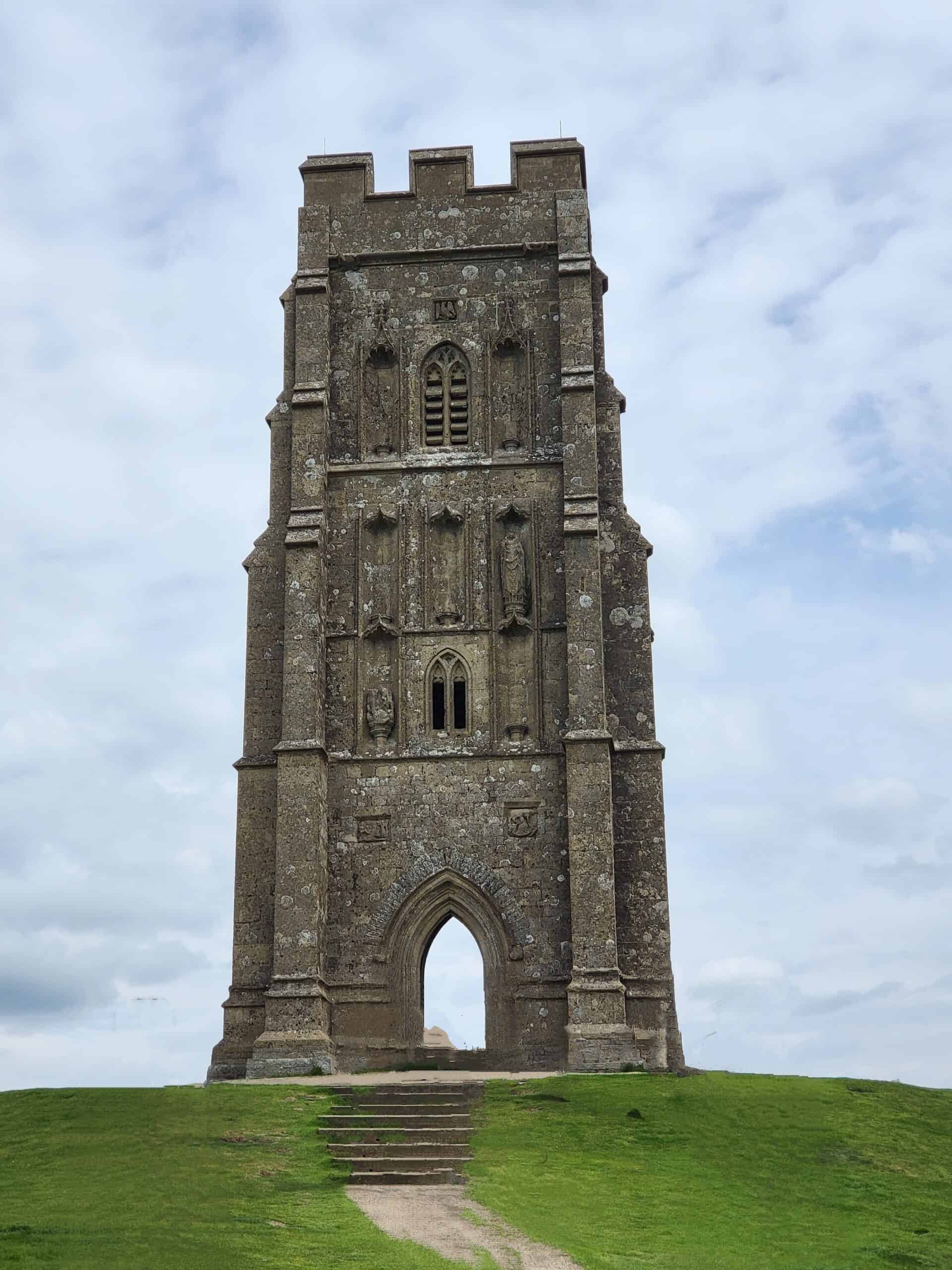A stone tower with a door and a window