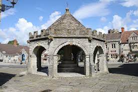 a stone structure with a cross on top