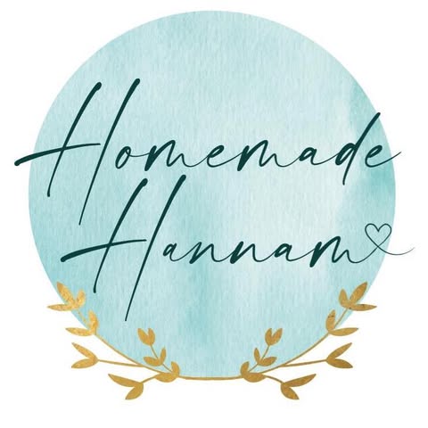 The words Homemade Hannam in dark blue against a light blue circular background with gold leaves around the bottom of the circle.