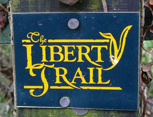 The liberty Trail written in yellow on a blue background