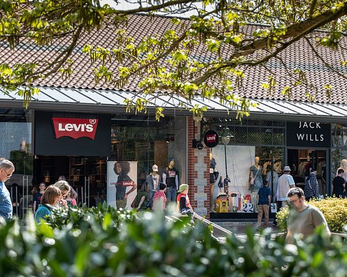 people shopping at Clarks Village in Street